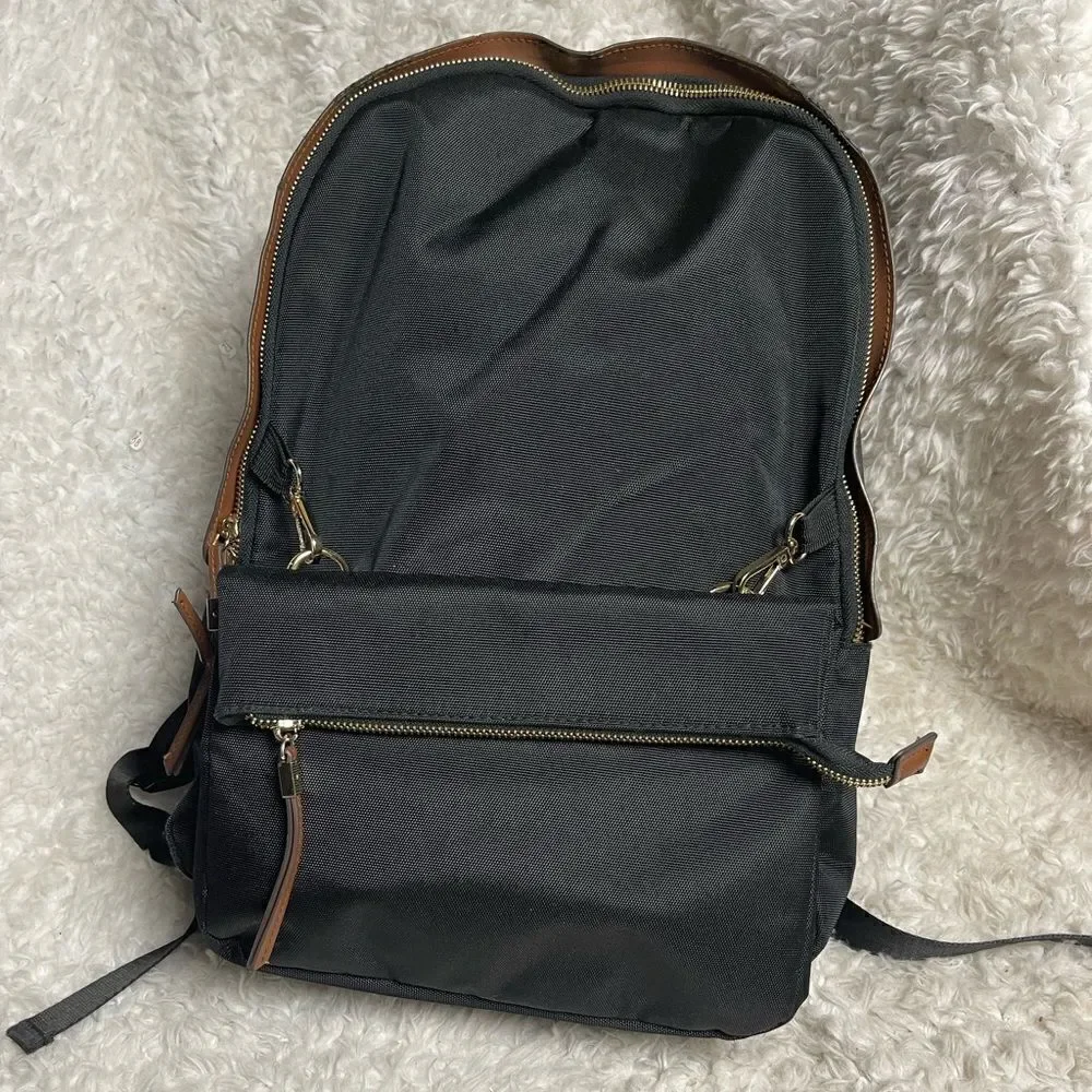 Tommy Bahama Black Laptop Case Backpack With Brown trims and straps .